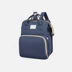 sac à dos à langer bleu avec poches zippées, design moderne pour accessoires bébé