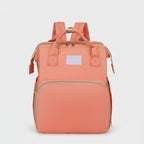 sac à dos à langer rose avec grande poche avant et étiquette 'You Are My Sunshine'